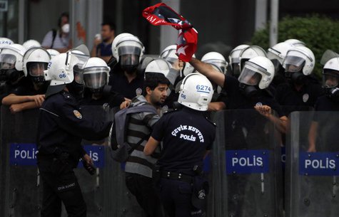 Riot police detain a demonstrator during protests at Kizilay square in central Ankara, June 16, 2013. REUTERS/Dado Ruvic (TURKEY - Tags: POL Riot police detain a demonstrator during protests at Kizilay square in central Ankara, June 16, 2013. REUTERS/Dado Ruvic (TURKEY - Tags: POL