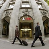 People walk past the headquarters of Swiss bank UBS in Zurich April 30, 2013. REUTERS/Arnd Wiegmann People walk past the headquarters of Swiss bank UBS in Zurich April 30, 2013. REUTERS/Arnd Wiegmann