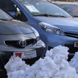 Piles of snow are seen next to parked cars at the yard of a car dealer in Berlin's Weissensee district March 26, 2013. REUTERS/Tobias Schwar
