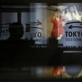 A visitor walks past logos at the Tokyo Stock Exchange in Tokyo June 13, 2013. REUTERS/Toru Hanai A visitor walks past logos at the Tokyo Stock Exchange in Tokyo June 13, 2013. REUTERS/Toru Hanai
