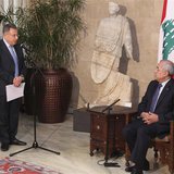 Lebanon's former Prime Minister Fouad Siniora (L) speaks during a meeting between Lebanon's President Michel Suleiman (R) and members of "Ma