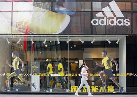 A woman walks past an Adidas shop at a shopping district in Beijing March 25, 2013. REUTERS/Kim Kyung-Hoon A woman walks past an Adidas shop at a shopping district in Beijing March 25, 2013. REUTERS/Kim Kyung-Hoon