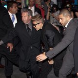 Singer Justin Bieber (C) arrives late for the premiere of the film "After Earth" in New York May 29, 2013. REUTERS/Carlo Allegri Singer Justin Bieber (C) arrives late for the premiere of the film "After Earth" in New York May 29, 2013. REUTERS/Carlo Allegri