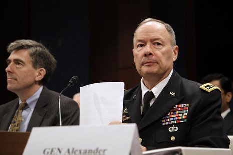 Director of the National Security Agency (NSA) U.S. Army General Keith Alexander arranges his notes as he arrives to testify before a U.S. R Director of the National Security Agency (NSA) U.S. Army General Keith Alexander arranges his notes as he arrives to testify before a U.S. R