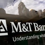 Buildings are reflected in the window of an M&T Bank branch in New York August 27, 2012. REUTERS/Brendan McDermid Buildings are reflected in the window of an M&T Bank branch in New York August 27, 2012. REUTERS/Brendan McDermid