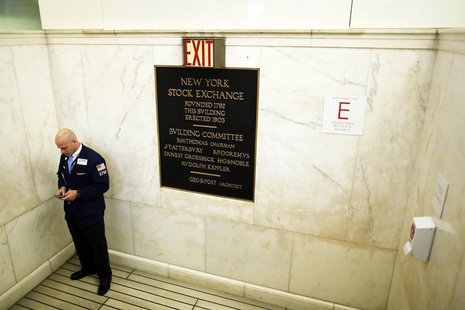 A trader looks at his phone in a stairwell just off the trading floor at the New York Stock Exchange, June 18, 2013. REUTERS/Brendan McDermi A trader looks at his phone in a stairwell just off the trading floor at the New York Stock Exchange, June 18, 2013. REUTERS/Brendan McDermi