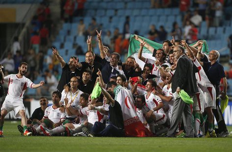 Iran's national soccer team celebrate after defeating South Korea in their World Cup qualifying soccer match in Ulsan, southeast of Seoul Ju Iran's national soccer team celebrate after defeating South Korea in their World Cup qualifying soccer match in Ulsan, southeast of Seoul Ju