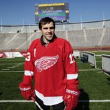 Detroit Red Wings player Pavel Datsyuk stands on the field at Michigan Stadium in Ann Arbor, Michigan February 9, 2012, following an announc Detroit Red Wings player Pavel Datsyuk stands on the field at Michigan Stadium in Ann Arbor, Michigan February 9, 2012, following an announc