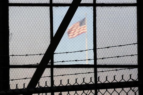 The flag over a war crimes courtroom in Camp Justice at US Naval Base Guantanamo Bay in Cuba in this photo reviewed by the U.S. Department o The flag over a war crimes courtroom in Camp Justice at US Naval Base Guantanamo Bay in Cuba in this photo reviewed by the U.S. Department o