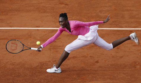 Venus Williams of the U.S. hits a return to Urszula Radwanska of Poland during their women's singles match at the French Open tennis tournam Venus Williams of the U.S. hits a return to Urszula Radwanska of Poland during their women's singles match at the French Open tennis tournam