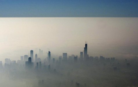 Blue sky is seen over a blanket of fog enveloping the skyline of Chicago, as photographed from an airplane window November 21, 2012. REUTERS Blue sky is seen over a blanket of fog enveloping the skyline of Chicago, as photographed from an airplane window November 21, 2012. REUTERS