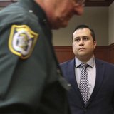George Zimmerman stands as the judge leaves the courtroom as jury selection continues in his second-degree murder trial in Sanford, Florida,