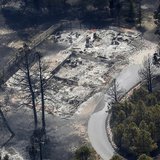 An aerial view of a destroyed house in the aftermath of the Black Forest Fire in Black Forest, Colorado June 13, 2013. REUTERS/Rick Wilking