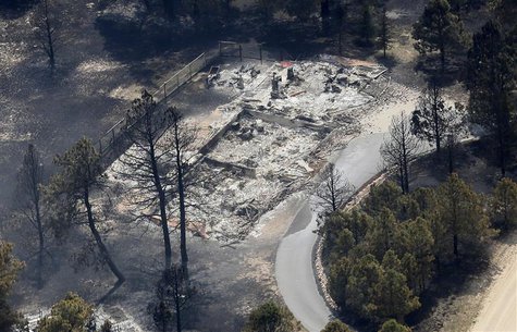 An aerial view of a destroyed house in the aftermath of the Black Forest Fire in Black Forest, Colorado June 13, 2013. REUTERS/Rick Wilking An aerial view of a destroyed house in the aftermath of the Black Forest Fire in Black Forest, Colorado June 13, 2013. REUTERS/Rick Wilking