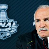 Chicago Blackhawks head coach Joel Quenneville listens to a question from a reporter in Boston, Massachusetts, June 18, 2013 ahead of Game 4