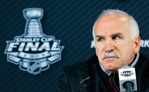 Chicago Blackhawks head coach Joel Quenneville listens to a question from a reporter in Boston, Massachusetts, June 18, 2013 ahead of Game 4 Chicago Blackhawks head coach Joel Quenneville listens to a question from a reporter in Boston, Massachusetts, June 18, 2013 ahead of Game 4