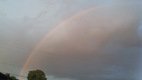 Kalamazoo Rainbow spans the west side as sunshine penetrates the rain. Kalamazoo Rainbow spans the west side as sunshine penetrates the rain.