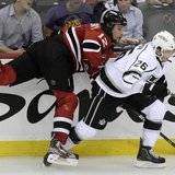 Los Angeles Kings' Slava Voynov (R) checks New Jersey Devils' Alexei Ponikarovsky during the second period in Game 1 of the NHL Stanley Cup Los Angeles Kings' Slava Voynov (R) checks New Jersey Devils' Alexei Ponikarovsky during the second period in Game 1 of the NHL Stanley Cup