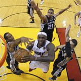 Miami Heat small forward LeBron James (6) goes to the basket past San Antonio Spurs' Tim Duncan (21), Danny Green (4) and Kawhi Leonard (2) Miami Heat small forward LeBron James (6) goes to the basket past San Antonio Spurs' Tim Duncan (21), Danny Green (4) and Kawhi Leonard (2)