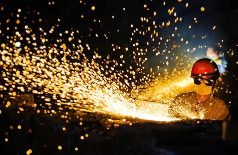 A worker wearing protective glasses welds steel products at a heavy equipment manufacturing factory in Luoyang, Henan province May 1, 2013. A worker wearing protective glasses welds steel products at a heavy equipment manufacturing factory in Luoyang, Henan province May 1, 2013.