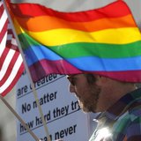 A man carries flags at a rally in support of same-sex marriage at the State of California Supreme Court in San Francisco, California March 2 A man carries flags at a rally in support of same-sex marriage at the State of California Supreme Court in San Francisco, California March 2