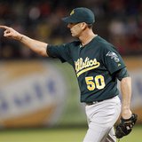Oakland Athletics pitcher Grant Balfour points to left field after getting the last out against the Texas Rangers in the ninth inning of the Oakland Athletics pitcher Grant Balfour points to left field after getting the last out against the Texas Rangers in the ninth inning of the