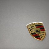 A logo is seen on a Porsche 911 Carrera 4S displayed ahead of the annual news conference at the Porsche headquarters in Stuttgart March 15, A logo is seen on a Porsche 911 Carrera 4S displayed ahead of the annual news conference at the Porsche headquarters in Stuttgart March 15,