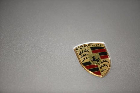 A logo is seen on a Porsche 911 Carrera 4S displayed ahead of the annual news conference at the Porsche headquarters in Stuttgart March 15, A logo is seen on a Porsche 911 Carrera 4S displayed ahead of the annual news conference at the Porsche headquarters in Stuttgart March 15,