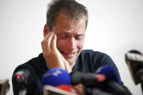Former 50 km race walk 2008 Olympic gold medalist Alex Schwazer of Italy reacts as he holds a news conference in Bolzano August 8, 2012. REU Former 50 km race walk 2008 Olympic gold medalist Alex Schwazer of Italy reacts as he holds a news conference in Bolzano August 8, 2012. REU