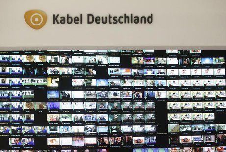 The logo of Germany's biggest cable operator, Kabel Deutschland, is pictured above a monitor wall at the Kabel Deutschland playout center in The logo of Germany's biggest cable operator, Kabel Deutschland, is pictured above a monitor wall at the Kabel Deutschland playout center in