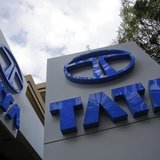 Tata Motors logos are seen at their flagship showroom in Mumbai February 14, 2013. REUTERS/Vivek Prakash Tata Motors logos are seen at their flagship showroom in Mumbai February 14, 2013. REUTERS/Vivek Prakash