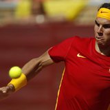 Rafael Nadal of Spain looks at the ball before returning a shot during his Davis Cup World Group semi-final against Jo-Wilfried Tsonga of Fr