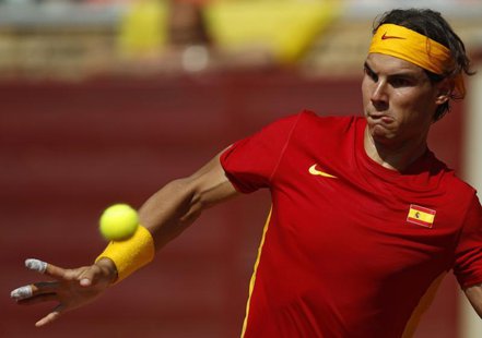 Rafael Nadal of Spain looks at the ball before returning a shot during his Davis Cup World Group semi-final against Jo-Wilfried Tsonga of Fr Rafael Nadal of Spain looks at the ball before returning a shot during his Davis Cup World Group semi-final against Jo-Wilfried Tsonga of Fr