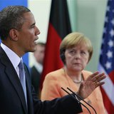 U.S. President Barack Obama speaks next to German Chancellor Angela Merkel during a news conference after their meeting at the Chancellery i U.S. President Barack Obama speaks next to German Chancellor Angela Merkel during a news conference after their meeting at the Chancellery i