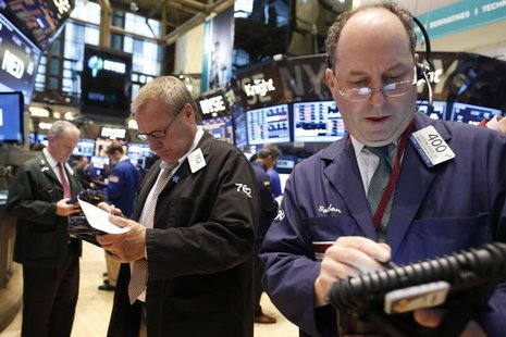 Traders work on the floor at the New York Stock Exchange, June 18, 2013. REUTERS/Brendan McDermid Traders work on the floor at the New York Stock Exchange, June 18, 2013. REUTERS/Brendan McDermid