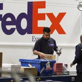 Handlers scan and affix a courier route label onto packages moving down the belt at the Marina Del Rey, California FedEx station December 12 Handlers scan and affix a courier route label onto packages moving down the belt at the Marina Del Rey, California FedEx station December 12
