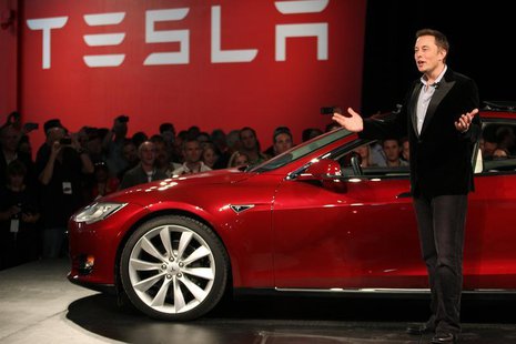 Tesla Motors CEO Elon Musk speaks next to the company's newest Model S during the Model S Beta Event held at the Tesla factory in Fremont, C Tesla Motors CEO Elon Musk speaks next to the company's newest Model S during the Model S Beta Event held at the Tesla factory in Fremont, C