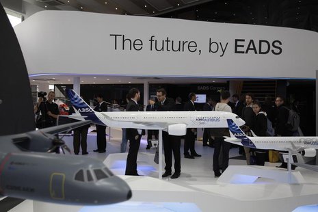 Visitors look at aircraft models at the EADS booth during the ILA Berlin Air Show in Selchow near Schoenefeld south of Berlin, September 13, Visitors look at aircraft models at the EADS booth during the ILA Berlin Air Show in Selchow near Schoenefeld south of Berlin, September 13,