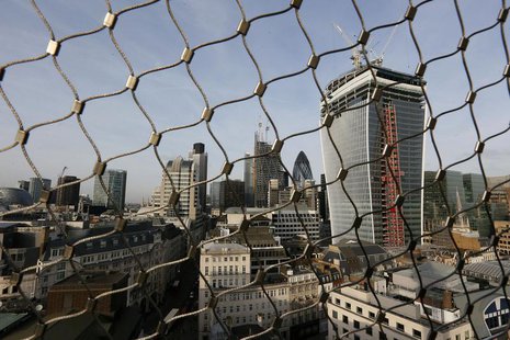 The City of London business district is seen through a wire fence in London February 28, 2013. REUTERS/Stefan Wermuth The City of London business district is seen through a wire fence in London February 28, 2013. REUTERS/Stefan Wermuth
