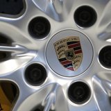 A logo is seen on a wheel of a Porsche 911 Carrera 4S ahead of the annual news conference at the Porsche headquarters in Stuttgart March 15, A logo is seen on a wheel of a Porsche 911 Carrera 4S ahead of the annual news conference at the Porsche headquarters in Stuttgart March 15,