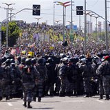 Members of the Brazilian law enforcement troops confront protestors ahead of the Confederations Cup soccer match between Brazil and Mexico o