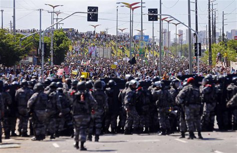 Members of the Brazilian law enforcement troops confront protestors ahead of the Confederations Cup soccer match between Brazil and Mexico o Members of the Brazilian law enforcement troops confront protestors ahead of the Confederations Cup soccer match between Brazil and Mexico o