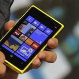 A Nokia executive shows the new Lumia 920 phone with Microsoft's Windows 8 operating system at a launch event in New York, September 5, 2012