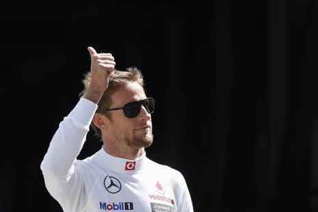 McLaren Formula One driver Jenson Button of Britain gestures before the third practice session of the Monaco F1 Grand Prix May 25, 2013. REU McLaren Formula One driver Jenson Button of Britain gestures before the third practice session of the Monaco F1 Grand Prix May 25, 2013. REU
