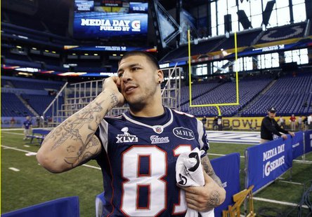 New England Patriots tight end Aaron Hernandez talks on a phone during media day for the NFL Super Bowl XLVI in Indianapolis January 31, 201 New England Patriots tight end Aaron Hernandez talks on a phone during media day for the NFL Super Bowl XLVI in Indianapolis January 31, 201