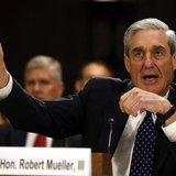 FBI Director Robert Mueller gestures at the U.S. Senate Judiciary Committee at an oversight hearing about the Federal Bureau of Investigatio FBI Director Robert Mueller gestures at the U.S. Senate Judiciary Committee at an oversight hearing about the Federal Bureau of Investigatio