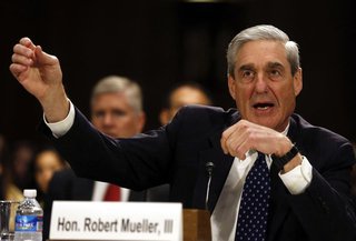 FBI Director Robert Mueller gestures at the U.S. Senate Judiciary Committee at an oversight hearing about the Federal Bureau of Investigatio