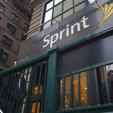 Pedestrians walk past a Sprint store in New York in this December 17, 2012 file photo. REUTERS/Andrew Kelly/Files Pedestrians walk past a Sprint store in New York in this December 17, 2012 file photo. REUTERS/Andrew Kelly/Files