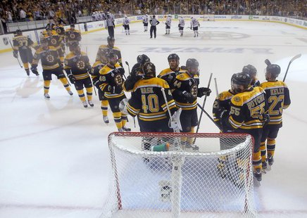 Boston Bruins goalie Tuukka Rask (40) is congratulated by hs teammates after shutting-out the Chicago Blackhawks in Game 3 of their NHL Stan Boston Bruins goalie Tuukka Rask (40) is congratulated by hs teammates after shutting-out the Chicago Blackhawks in Game 3 of their NHL Stan