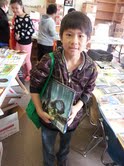 Peter Vang, fourth grade, after selecting his summer reading books at Washington School. Peter Vang, fourth grade, after selecting his summer reading books at Washington School.